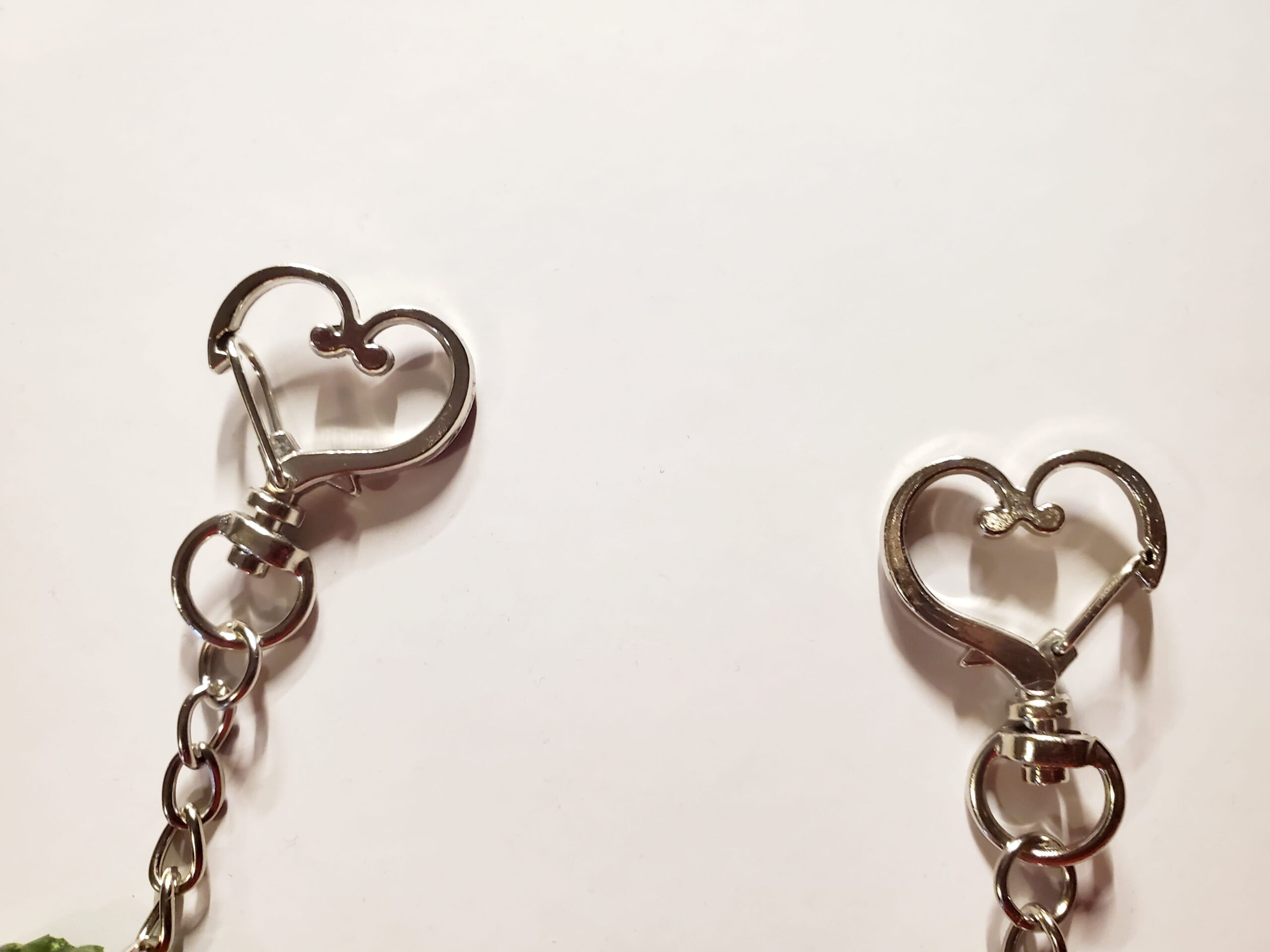 2 heart-shaped keychain hooks