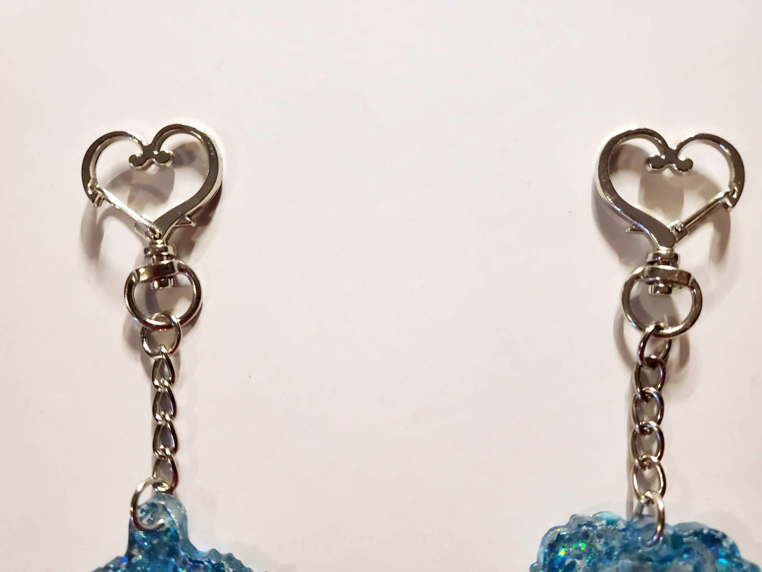 zoomed in picture of 2 heart-shaped keychain hooks